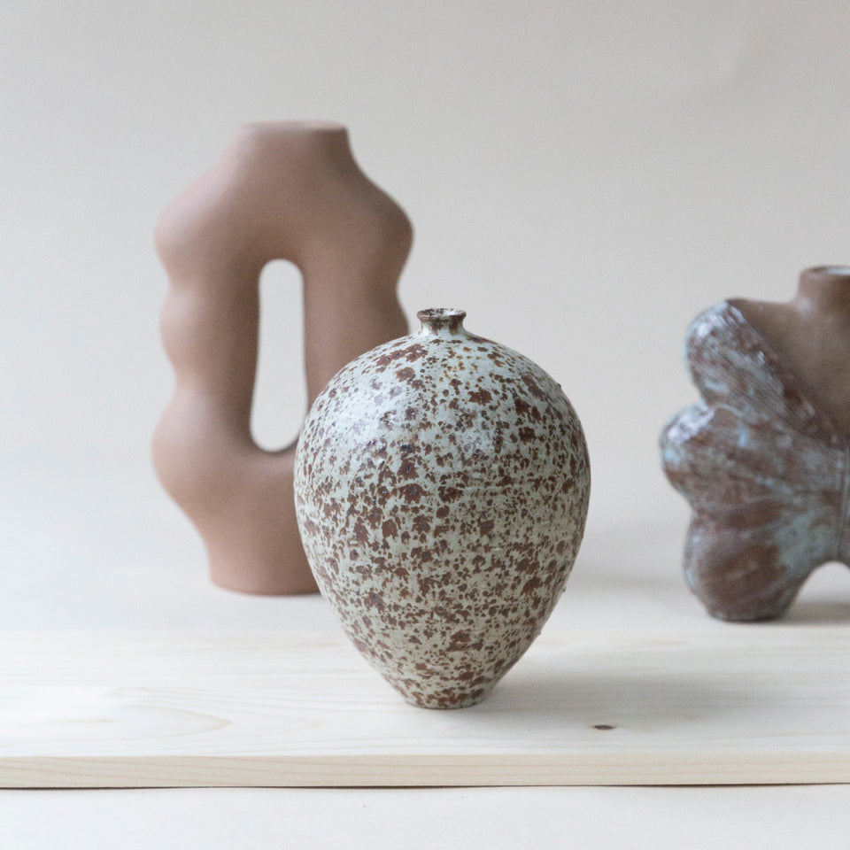 Bud vase with volcanic rocks 1